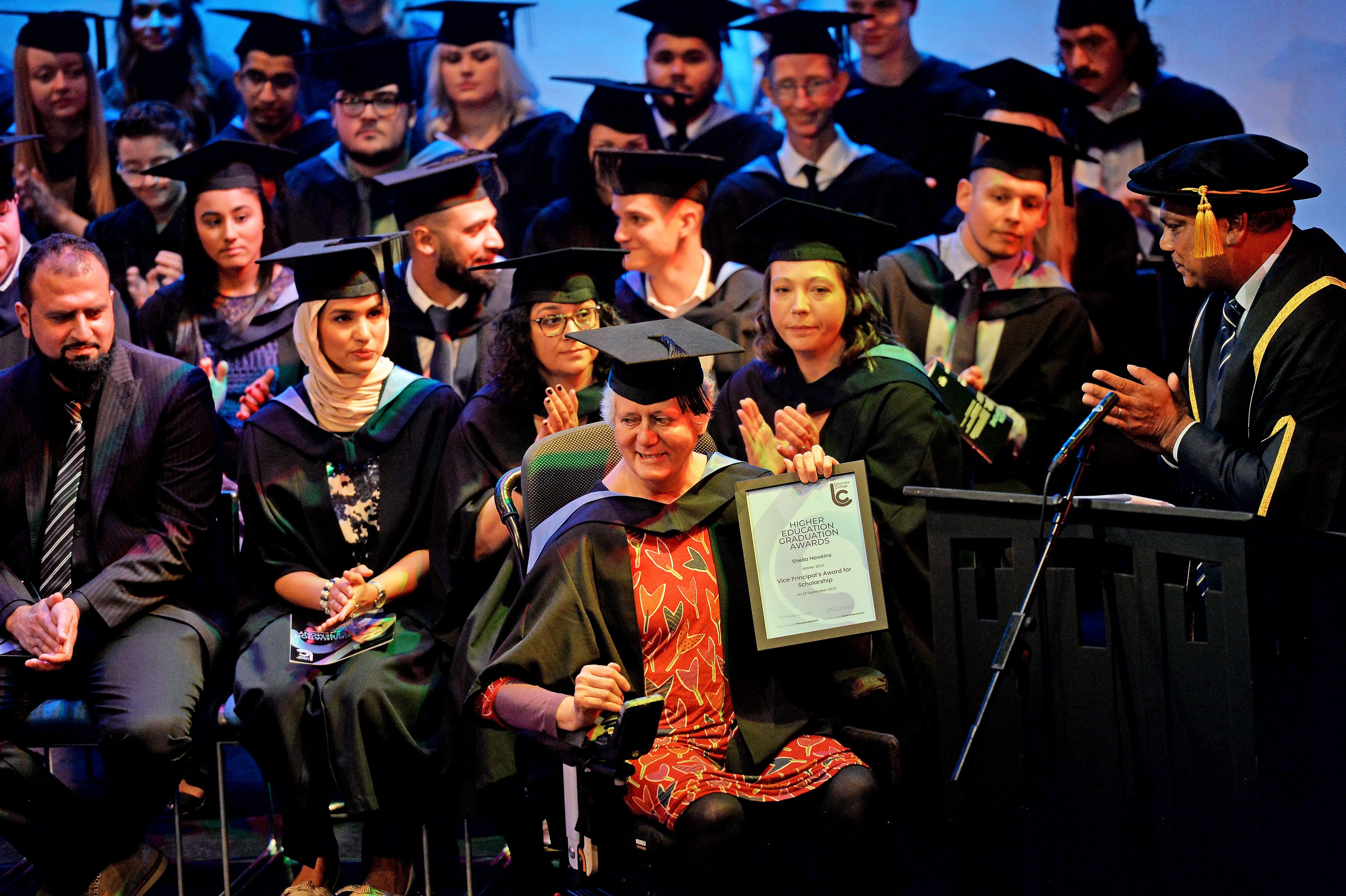 Image of graduates on stage