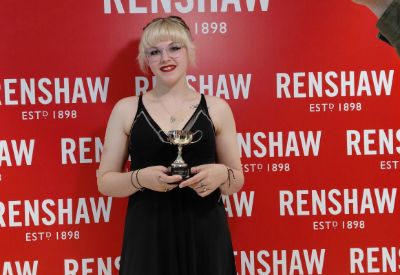 Leicester College student, Emily Carter holding her trophy at the Renshaw Cup